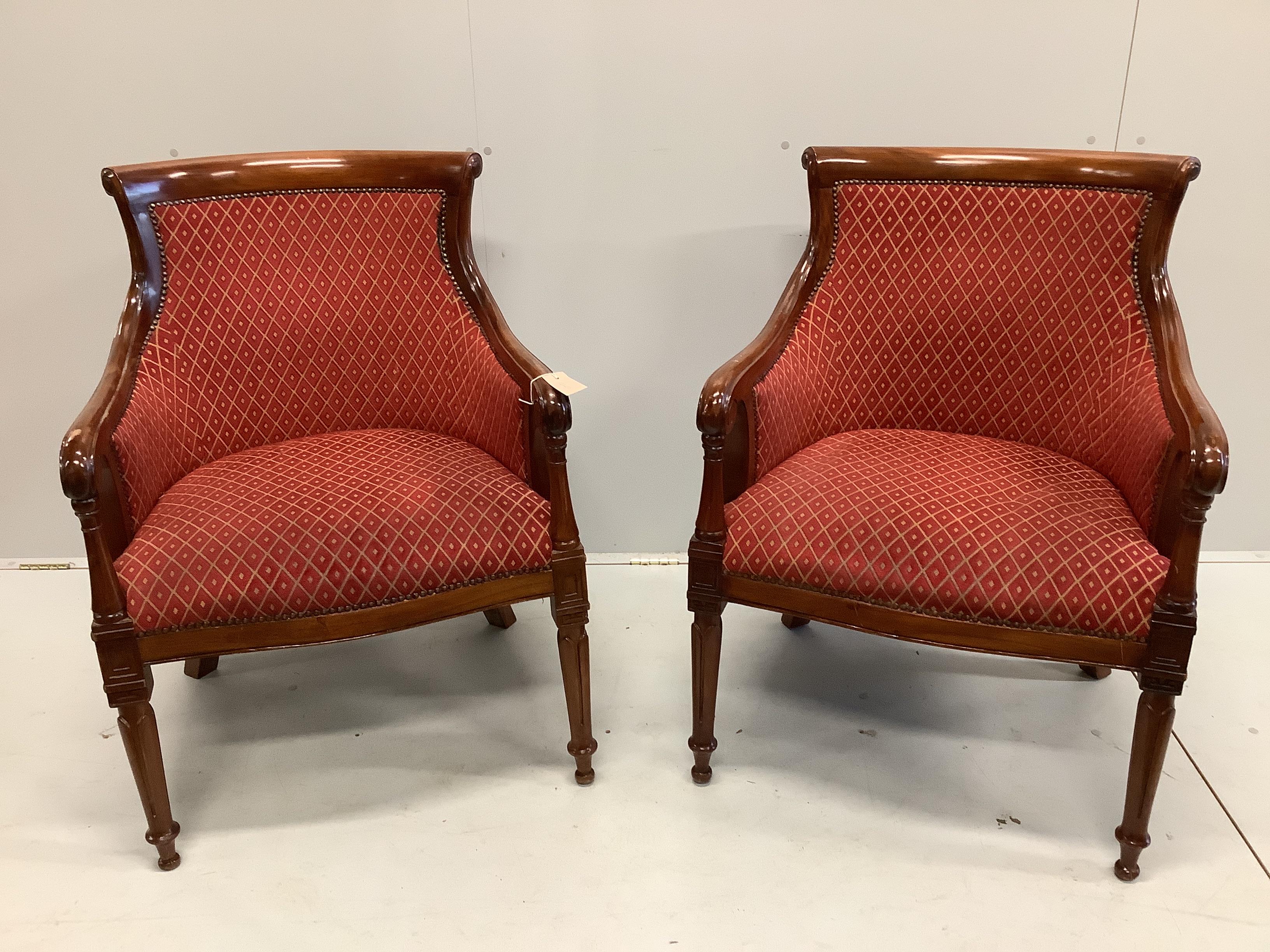 A pair of Empire style upholstered mahogany armchairs, width 65cm, depth 56cm, height 92cm